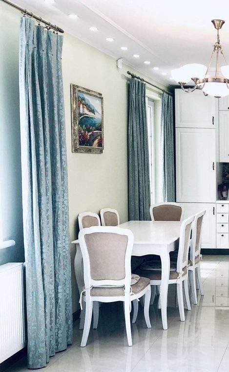 Blue-grey curtains in a dining room